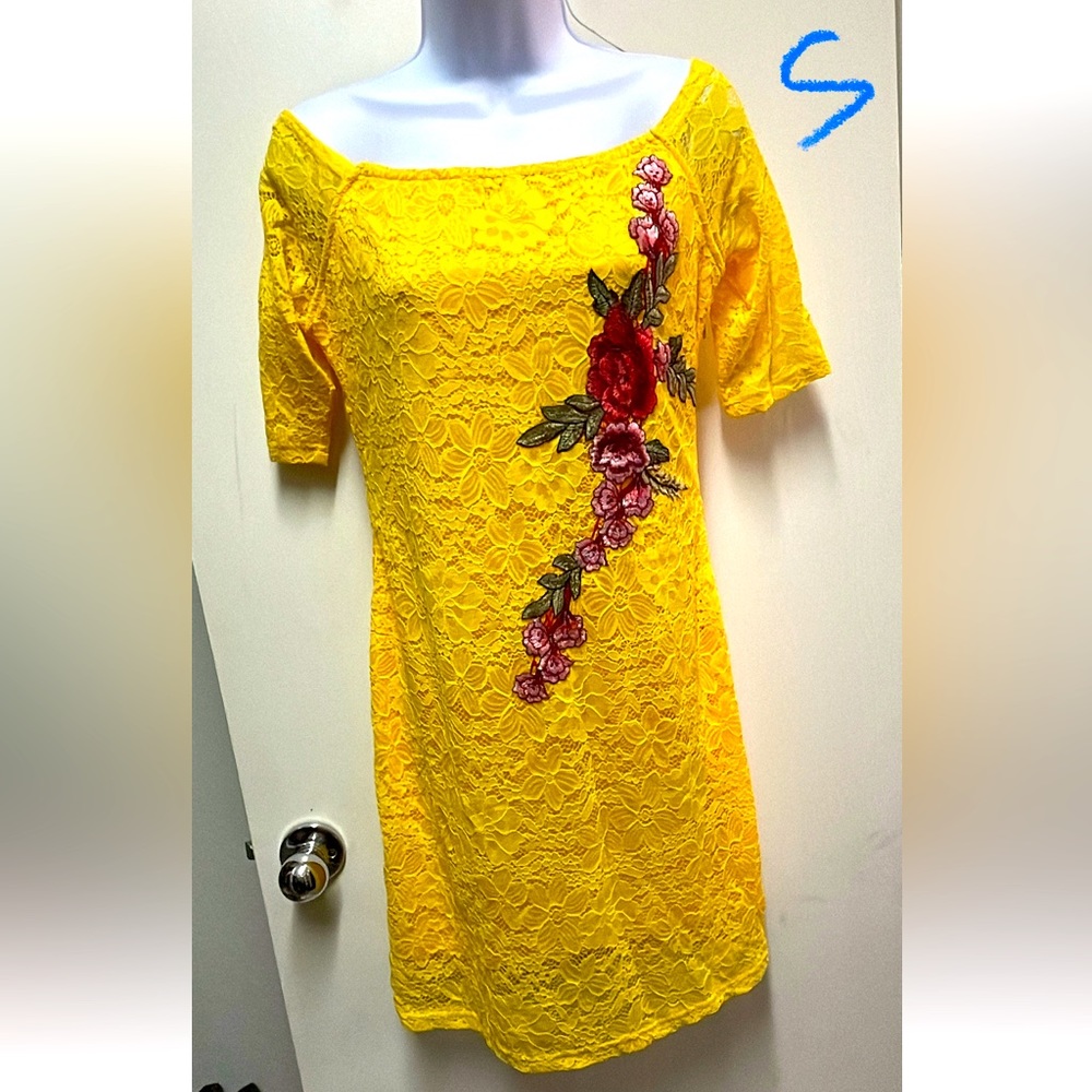 Yellow lace dress with beautiful flower detail.